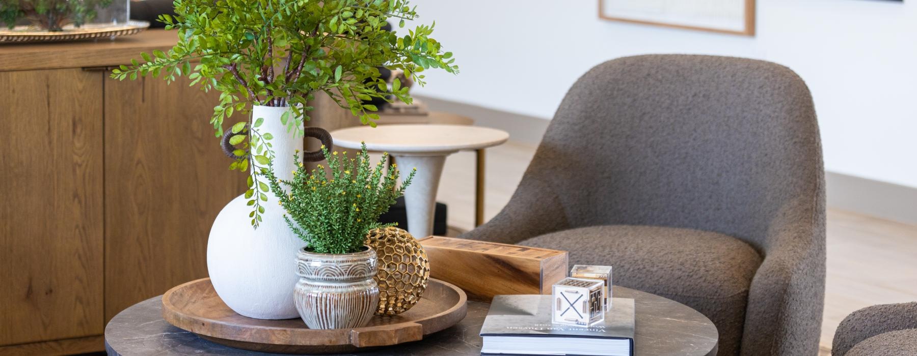 a chair and a table with plants on it