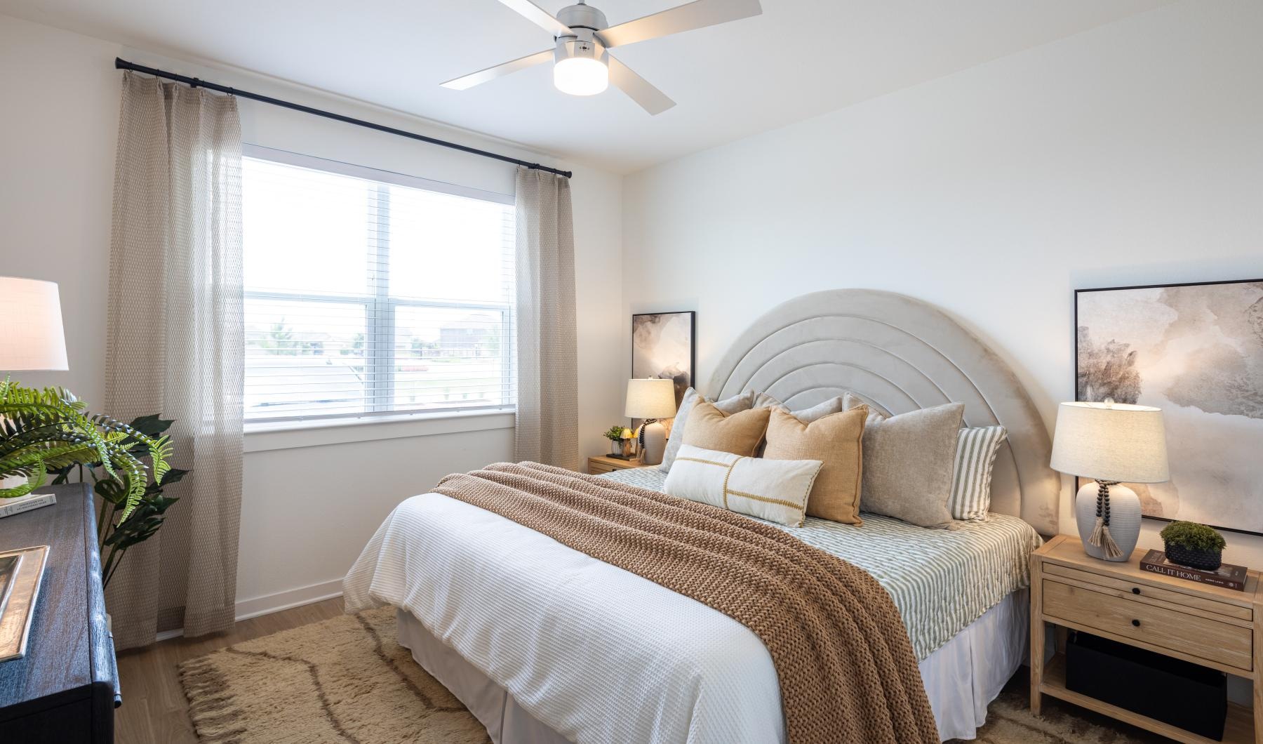 a bedroom with a large window