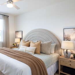 a bedroom with a large window