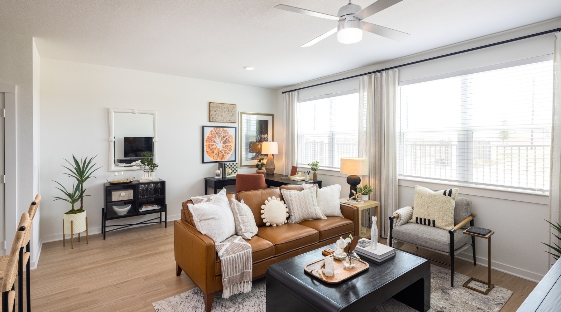 living room with a large window and open spaces