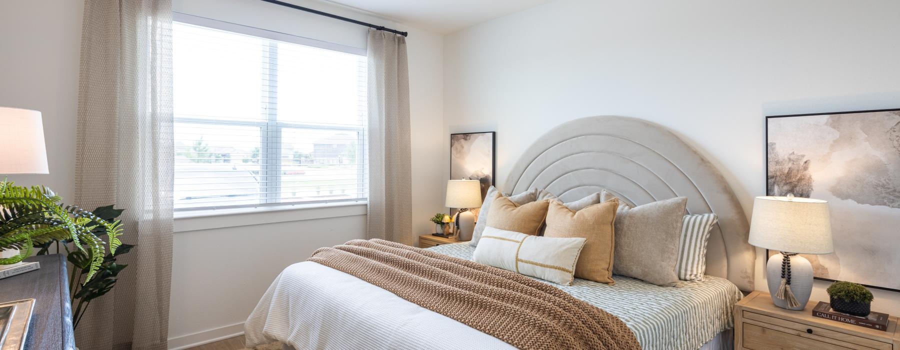 a bedroom with a large window